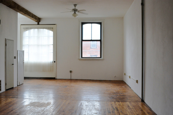 Looking towards the front of the loft you can see the oversized windows that flood the space with light