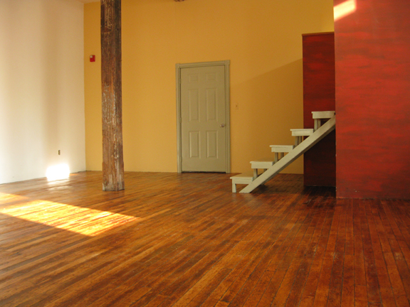In the 600 sq foot rear space there is a raised sleeping loft on the right with a storage area beneath it